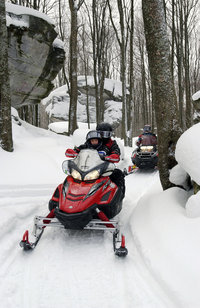 Family snowmobiling in Allegany State Park