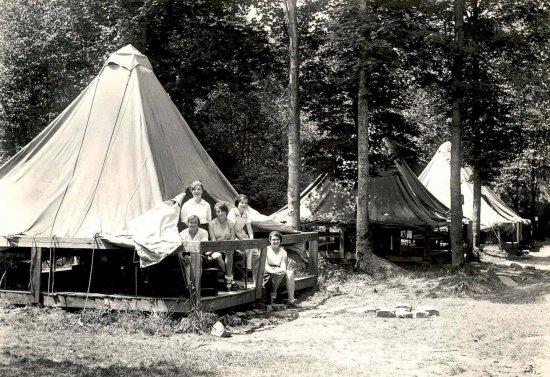 (Old photo) Girls looking out of a platform tent in Allegany State Park