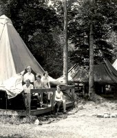 (Old photo) Girls looking out of a platform tent in Allegany State Park
