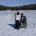 Father and Daughter holding fish they caught ice fishing at Allegany State Park