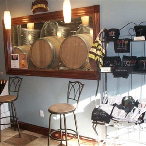 Photo of Winery of Ellicottville's interior and wine barrels